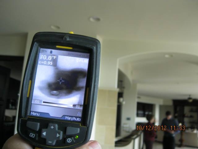 Thermal imaging camera detecting hidden moisture in Las Vegas home ceiling during mold assessment, Mold Eliminators